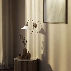 Wall lamp with adjustable brass arm and conical glossy white glass shade, elegant Made in Italy design by Ghidini 1849 - Finish: OAS Antique Brass