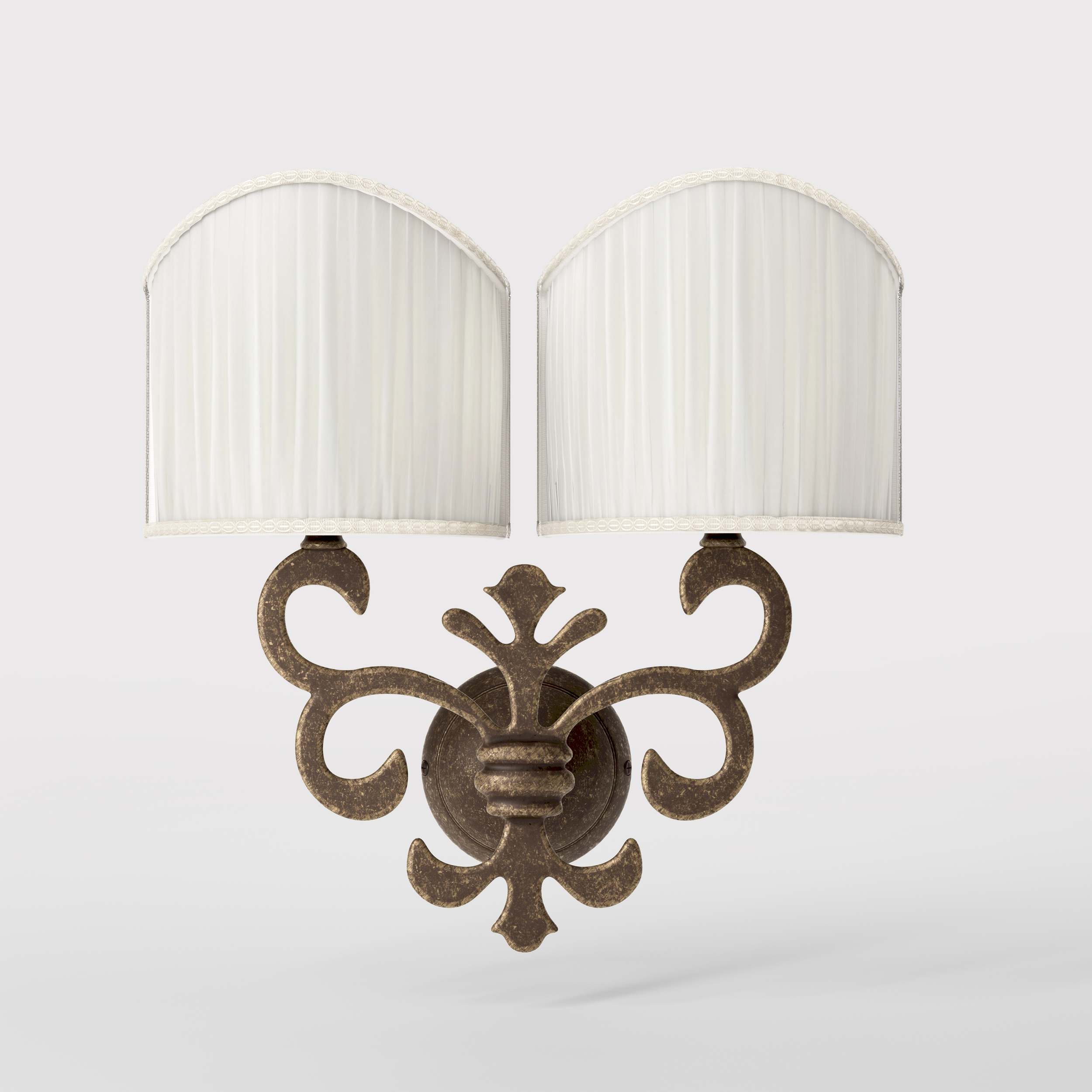 Neoclassical twin brass wall lamp with fleur-de-lis motif and symmetrical scrolls, white pleated shades, elegant Italian design - Finish: OAS Antique Brass