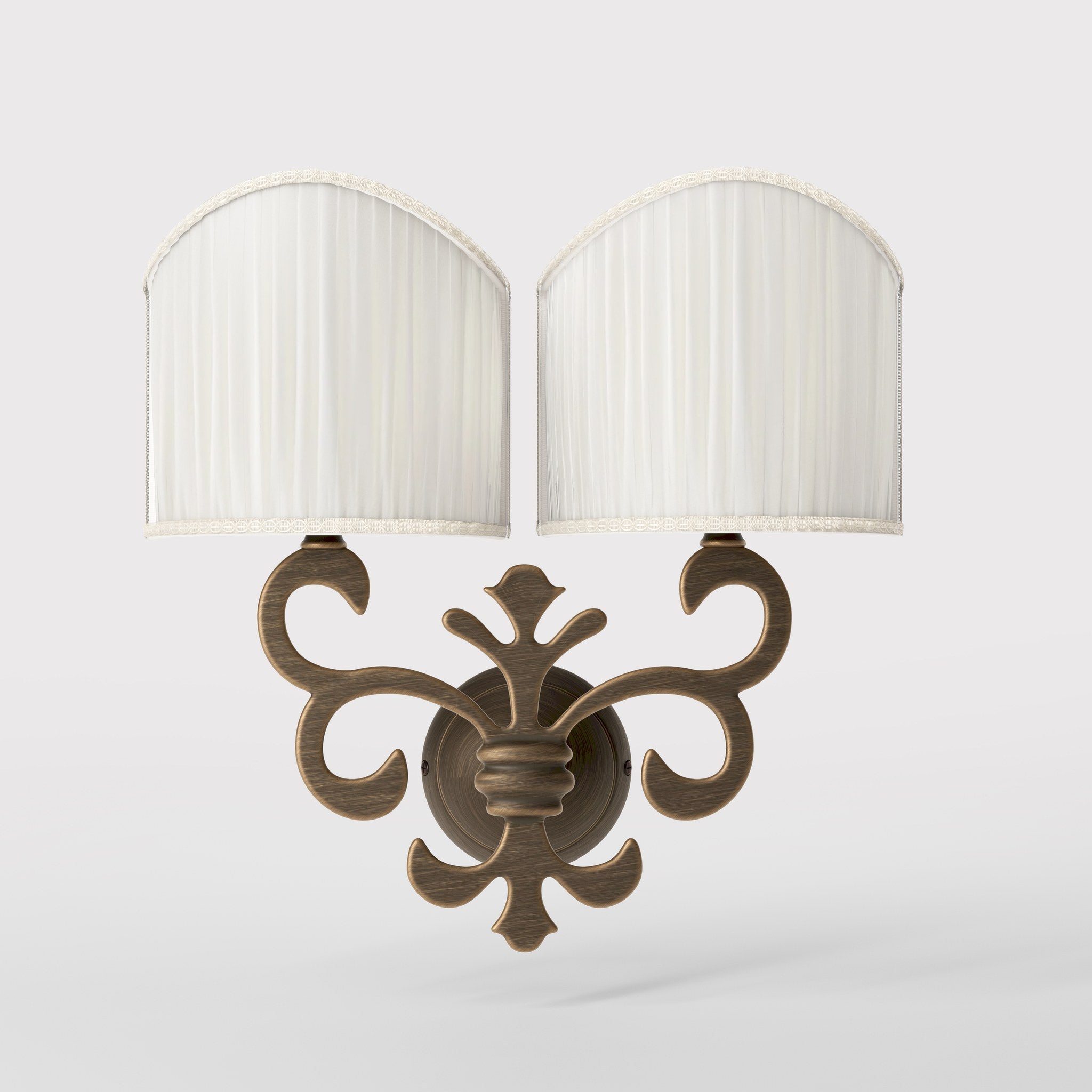 Neoclassical twin brass wall lamp with fleur-de-lis motif and symmetrical scrolls, white pleated shades, elegant Italian design - Finish: OBM Bronze Satin Matt Brass