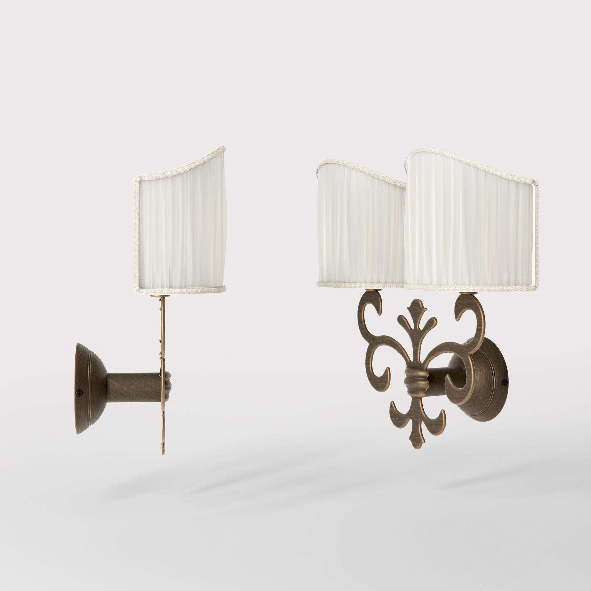 Neoclassical twin brass wall lamp with fleur-de-lis motif and symmetrical scrolls, white pleated shades, elegant Italian design - Finish: OBM Bronze Satin Matt Brass