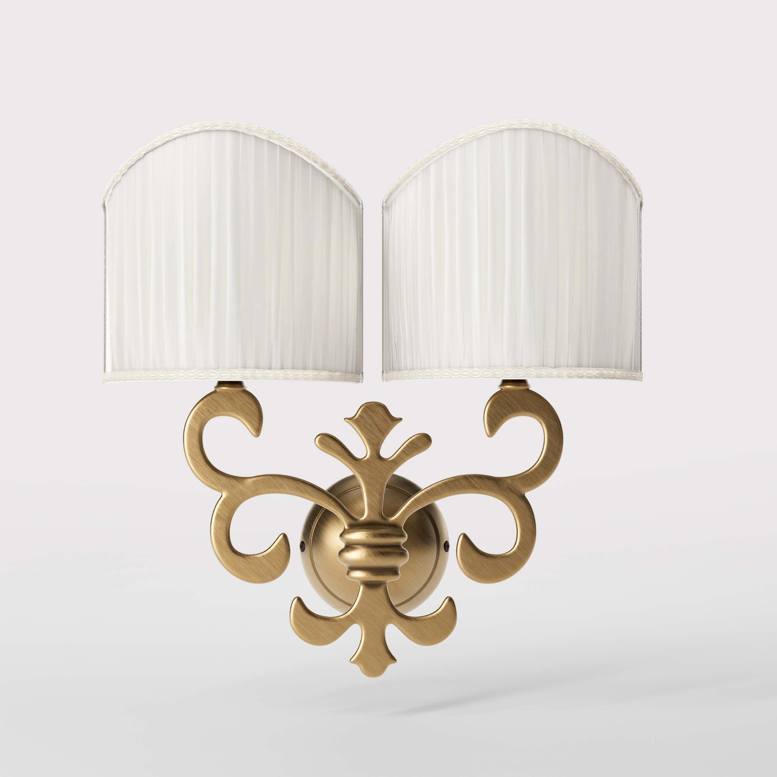 Neoclassical twin brass wall lamp with fleur-de-lis motif and symmetrical scrolls, white pleated shades, elegant Italian design - Finish: OBS Bronze Satin Brass