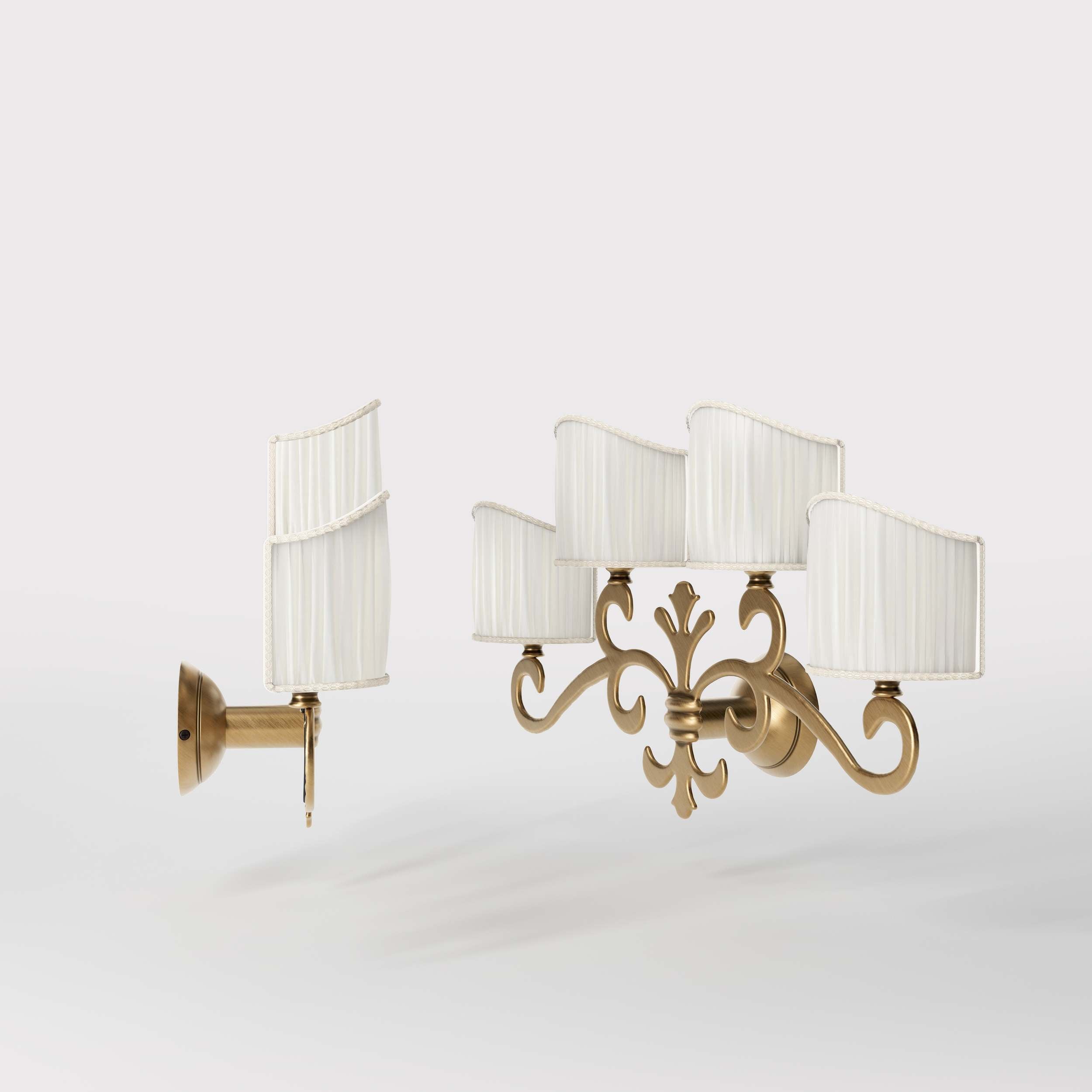 Classical four-light brass wall lamp with central fleur-de-lis and decorative scrolls, white pleated shades, refined Italian design - Finish: OBS Bronze Satin Brass