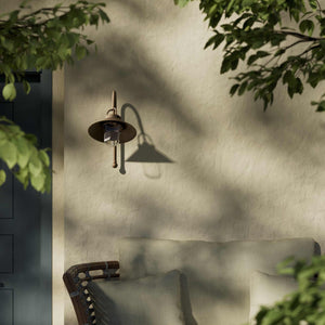 Country style outdoor brass wall lamp with arched arm protective hood and transparent glass diffuser Giada collection by Ghidini 1849 - Finish: OBM Bronze Satin Matt Brass