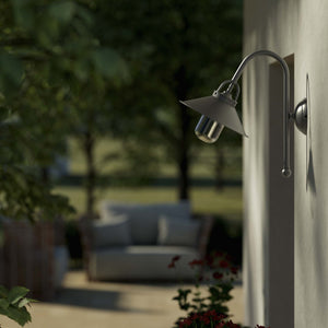 Country style outdoor brass wall lamp with arched arm protective hood and transparent glass diffuser Giada collection by Ghidini 1849 - Finish: OBR Dark Bronze