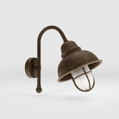 Outdoor industrial wall lamp Chronos with brass structure, bell-shaped diffuser and protective transparent glass cage for exterior lighting by Ghidini 1849 - Finish: OAS Antique Brass