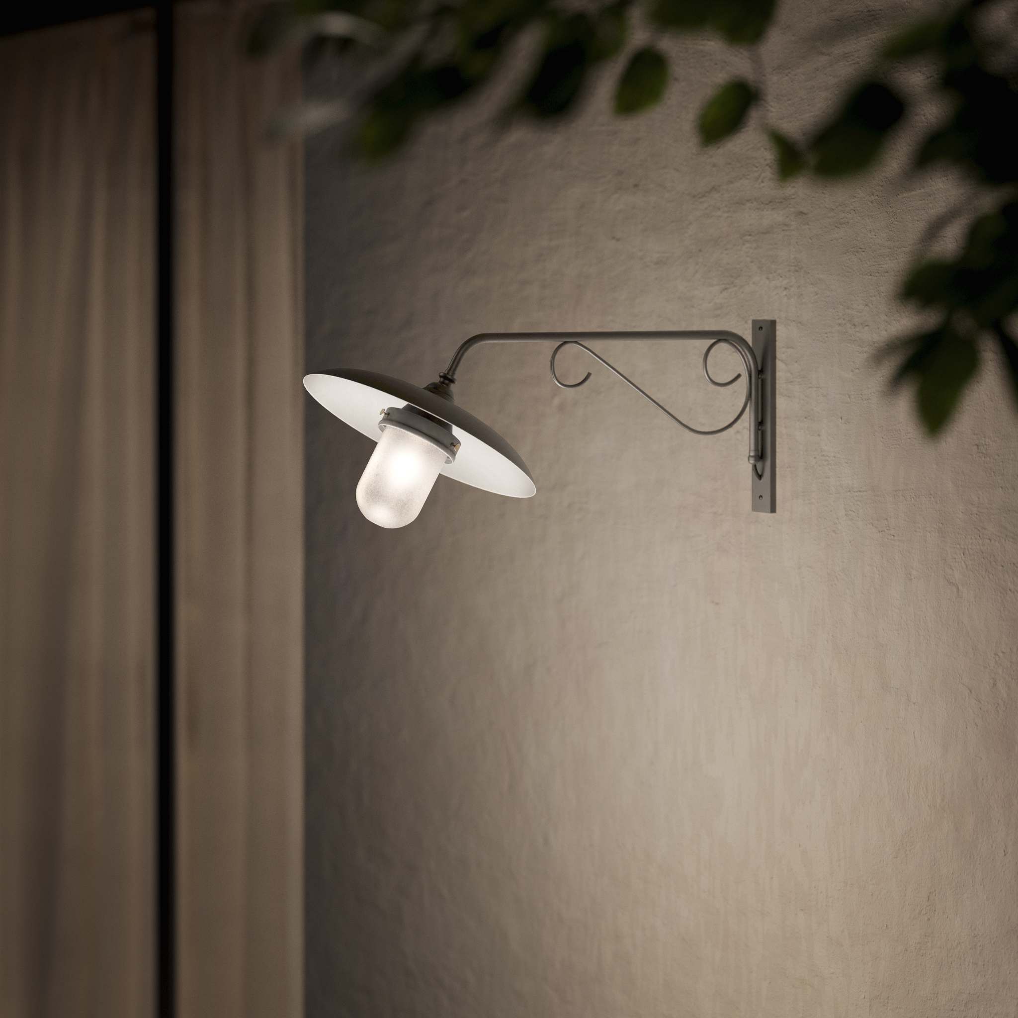 Brass outdoor wall lamp with decorative arm and protected glass by Ghidini 1849 - Finish: OBR Dark Bronze