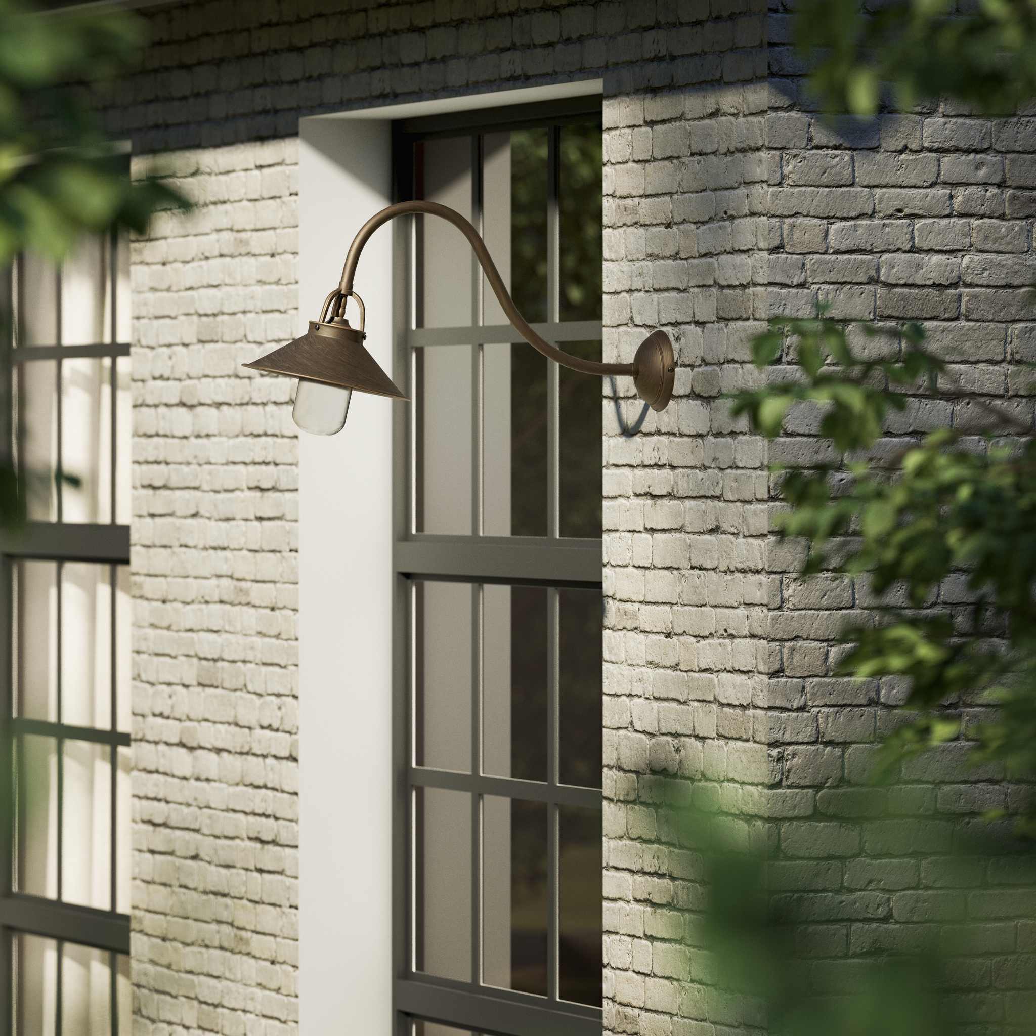 Classic style outdoor brass wall lamp with curved arm conical shade and transparent glass diffuser Giada collection by Ghidini 1849 - Finish: OBM Bronze Satin Matt Brass