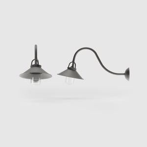 Classic style outdoor brass wall lamp with curved arm conical shade and transparent glass diffuser Giada collection by Ghidini 1849 - Finish: OBR Dark Bronze