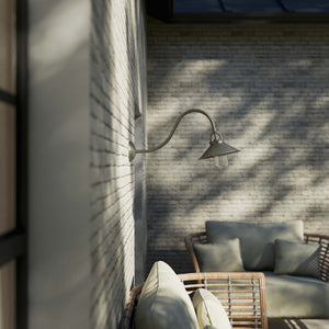 Classic style outdoor brass wall lamp with curved arm conical shade and transparent glass diffuser Giada collection by Ghidini 1849 - Finish: OBR Dark Bronze