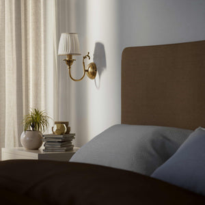Classic brass wall lamp with pleated ivory white shade, decorative arm and floral details for elegant wall lighting - Finish: OBS Bronze Satin Brass