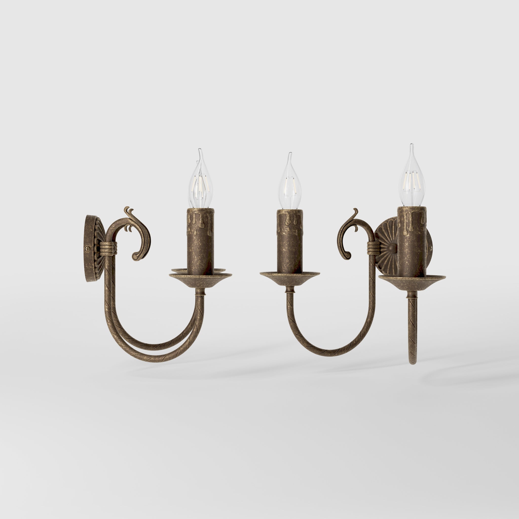 Classic double wall lamp in brass with fan-decorated central rosette, intertwined arms and lamp holders with dripping wax pattern by Ghidini 1849 - Finish: OAS Antique Brass