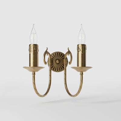 Classic double wall lamp in brass with fan-decorated central rosette, intertwined arms and lamp holders with dripping wax pattern by Ghidini 1849 - Finish: OBS Bronze Satin Brass