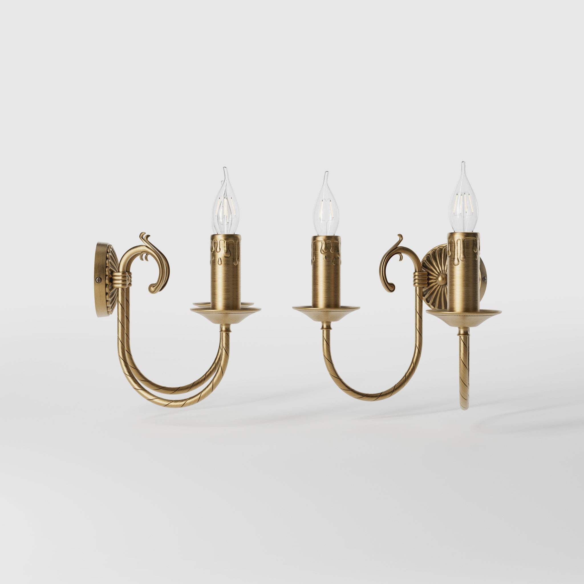 Classic double wall lamp in brass with fan-decorated central rosette, intertwined arms and lamp holders with dripping wax pattern by Ghidini 1849 - Finish: OBS Bronze Satin Brass
