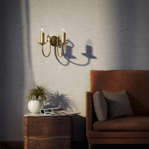 Classic double wall lamp in brass with fan-decorated central rosette, intertwined arms and lamp holders with dripping wax pattern by Ghidini 1849 - Finish: OBS Bronze Satin Brass