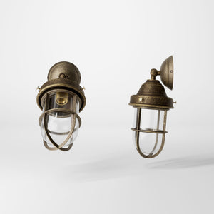 Rustic outdoor wall light in brass with clear glass shade, industrial maritime design, and adjustable joint by Ghidini 1849 - Finish: OAS Antique Brass