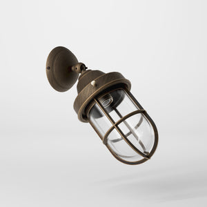 Rustic outdoor wall light in brass with clear glass shade, industrial maritime design, and adjustable joint by Ghidini 1849 - Finish: OBM Bronze Satin Matt Brass