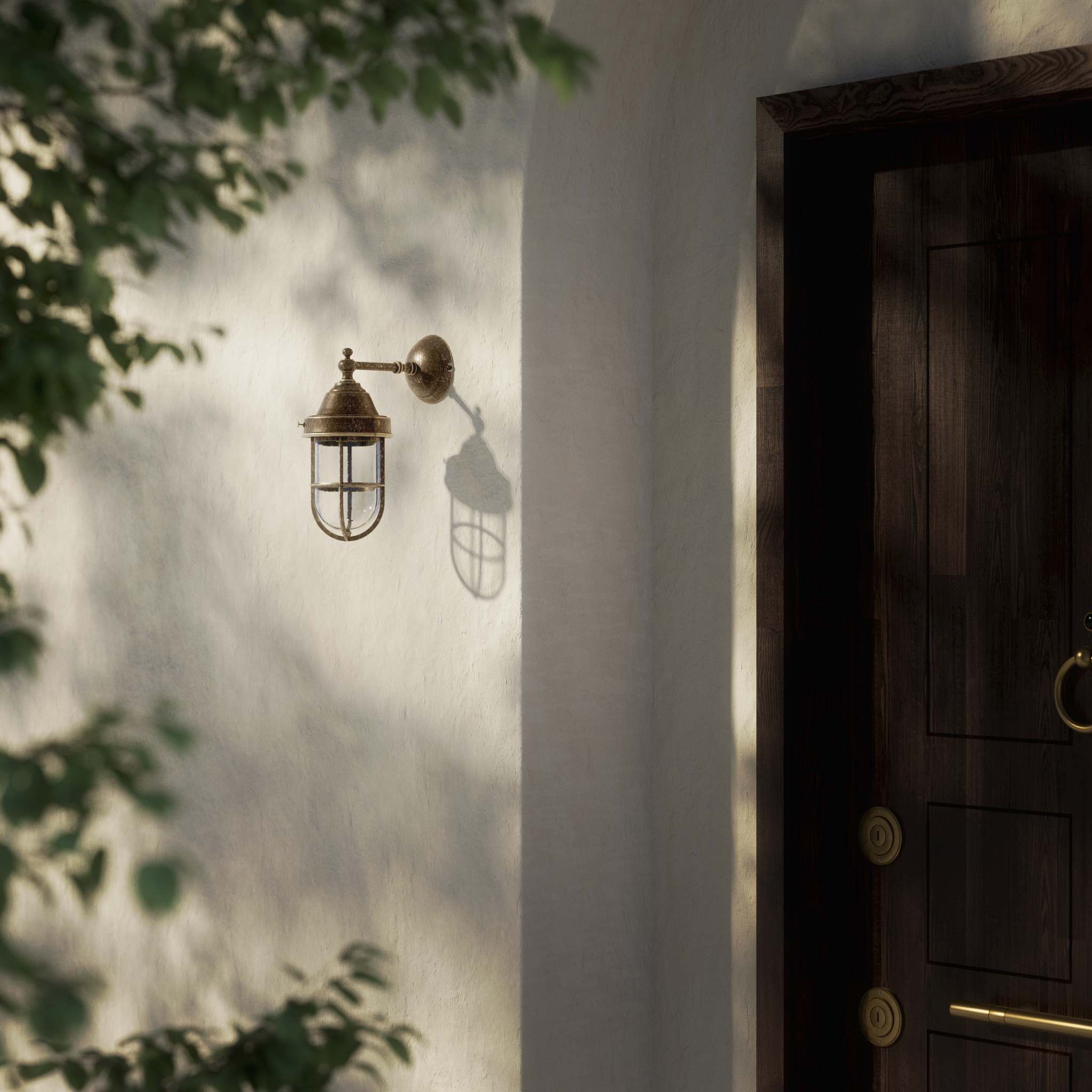 Outdoor wall lamp in brass with a transparent glass cage, industrial style, weather-resistant by Ghidini 1849 - Finish: OAS Antique Brass