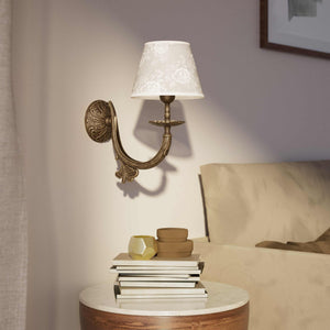 Classical brass wall lamp with decorated white fabric shade, curved arm and ornamental rosette, traditional floral details - Finish: OAS Antique Brass
