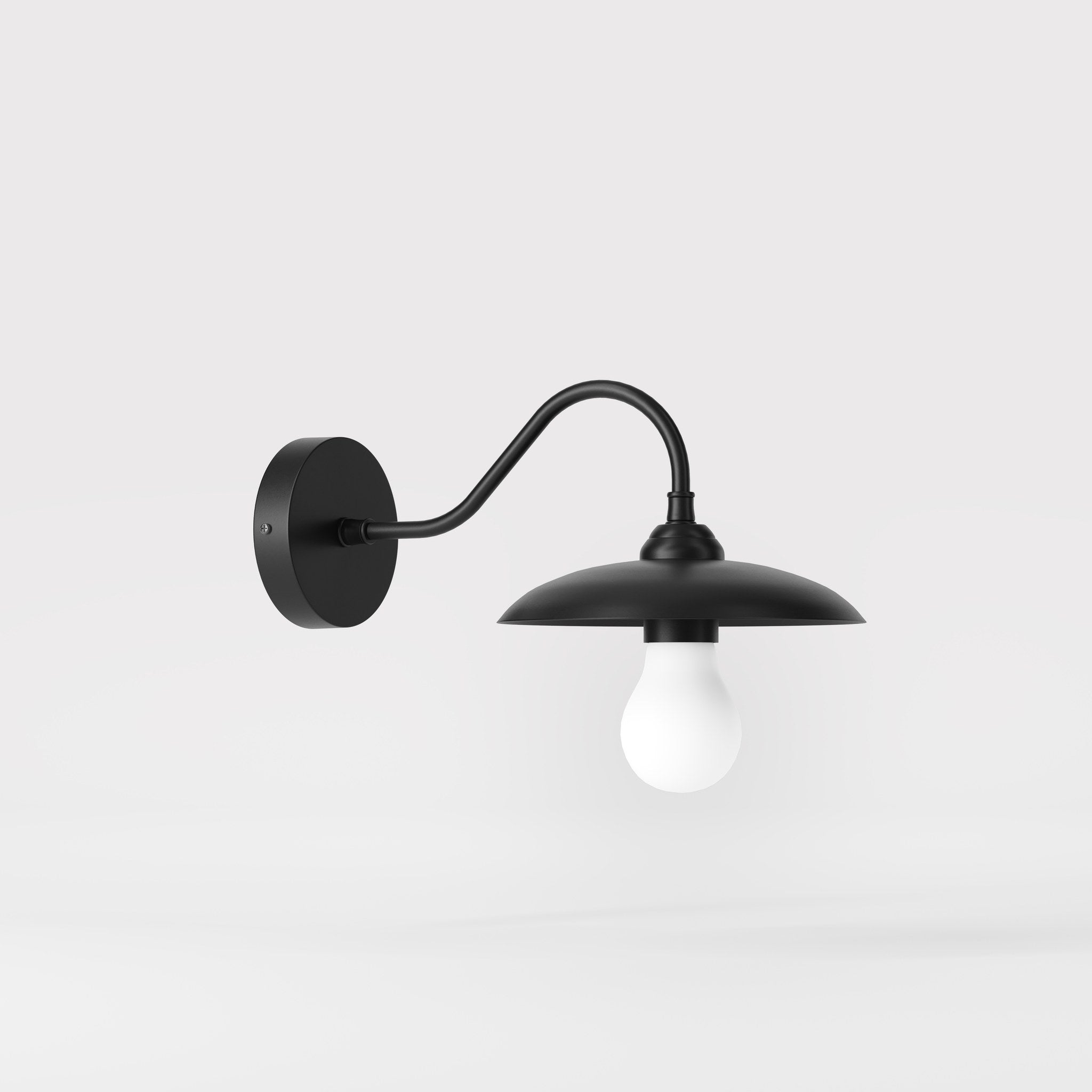 Vintage brass wall lamp with curved arm, ideal for sophisticated interiors by Ghidini 1849 - Finish: ONO Matt Black