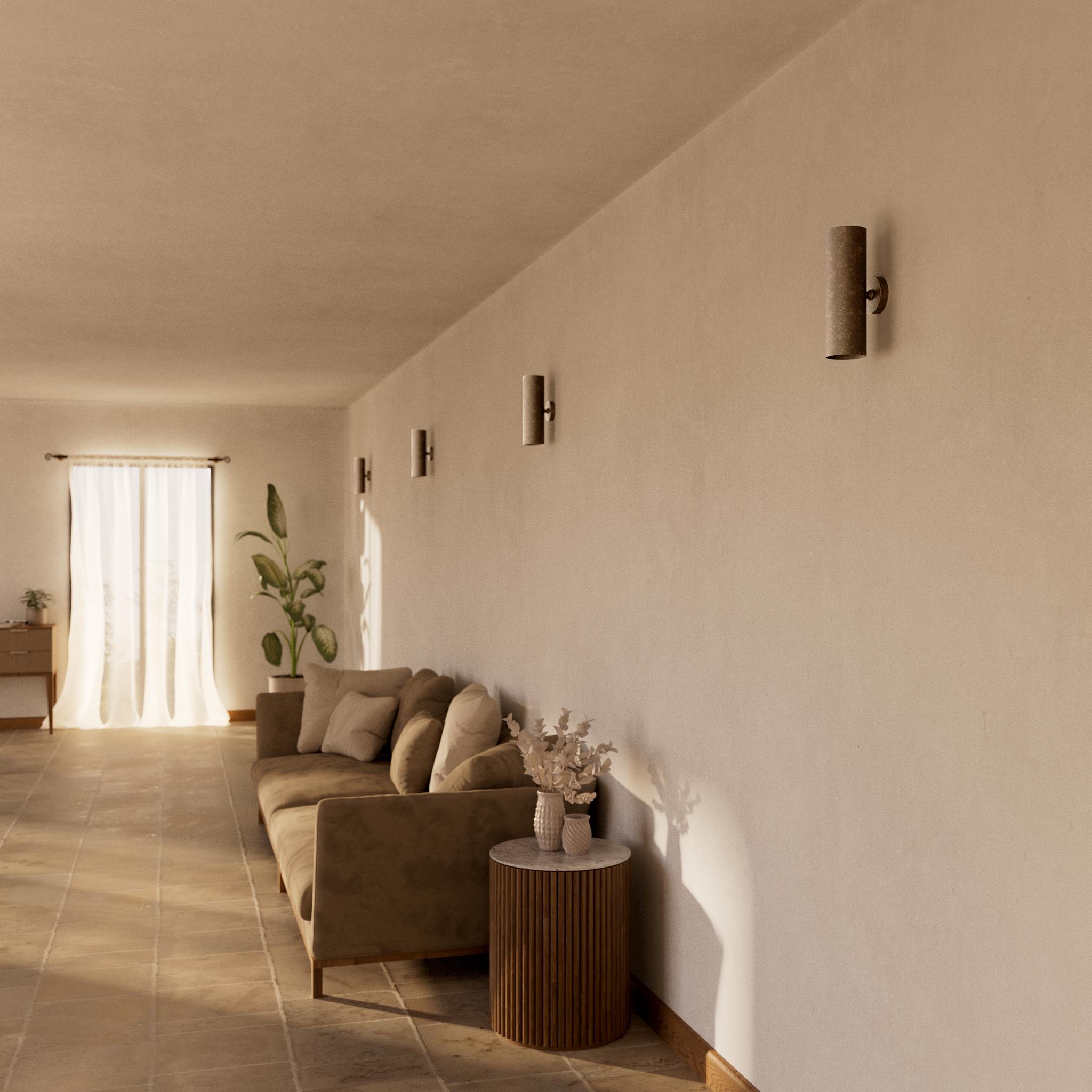 Cylindrical brass wall lamp with up and down light, modern minimalist design by Ghidini 1849 - Finish: OAS Antique Brass