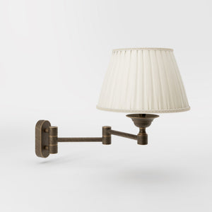 Brass wall lamp with ivory fabric lampshade and adjustable arms for elegant interior spaces by Ghidini 1849 - Finish: OBM Bronze Satin Matt Brass