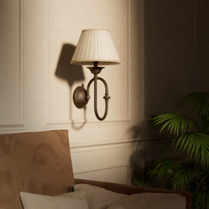 Classic brass wall lamp with curved arm and ivory pleated shade, design inspired by musical instruments Made in Italy by Ghidini 1849 - Finish: OAS Antique Brass