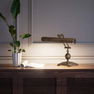 Executive brass desk lamp with cylindrical shade and dual articulation points mounted on decorative square base with spherical accent by Ghidini 1849 - Finish: OAS Antique Brass