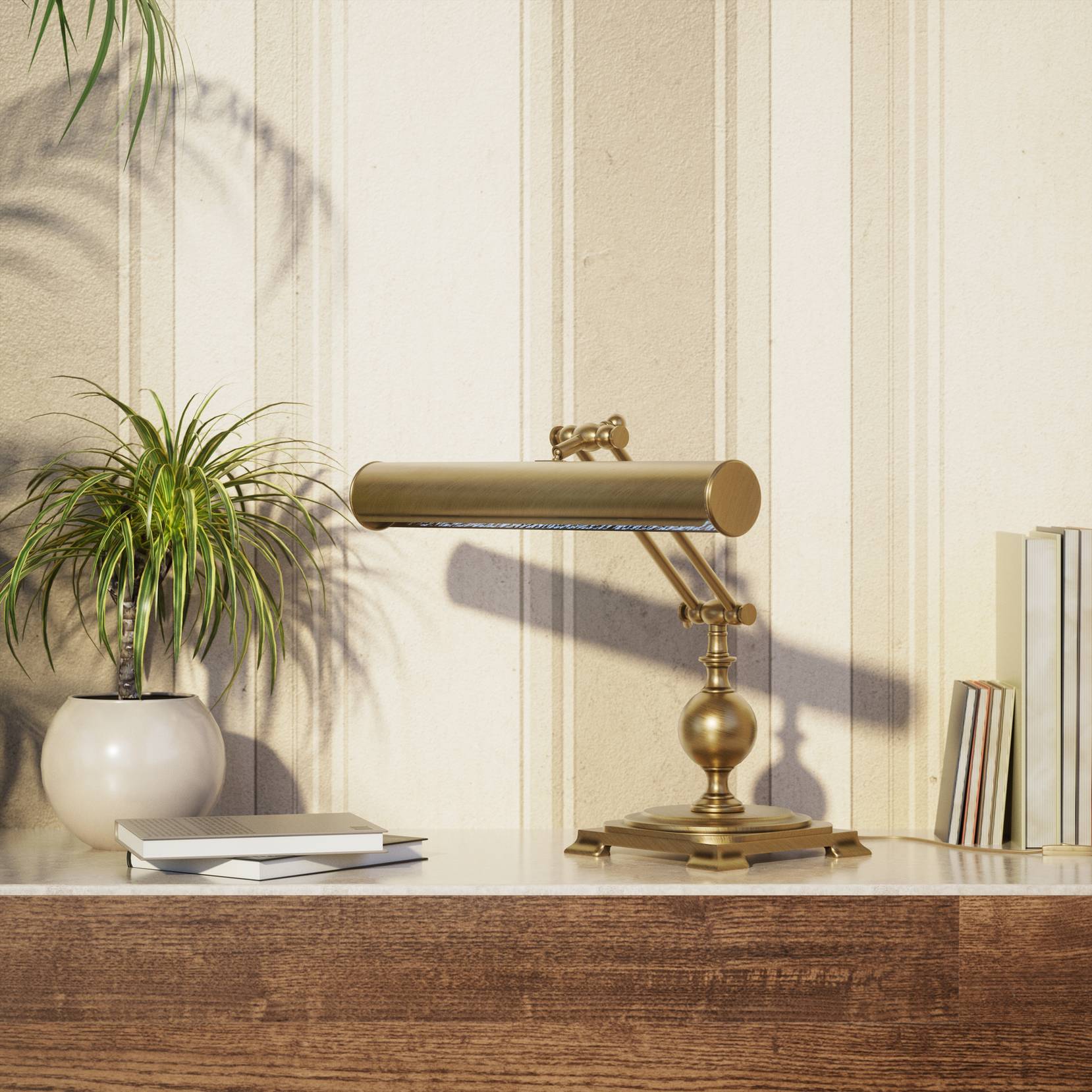 Executive brass desk lamp with cylindrical shade and dual articulation points mounted on decorative square base with spherical accent by Ghidini 1849 - Finish: OBS Bronze Satin Brass
