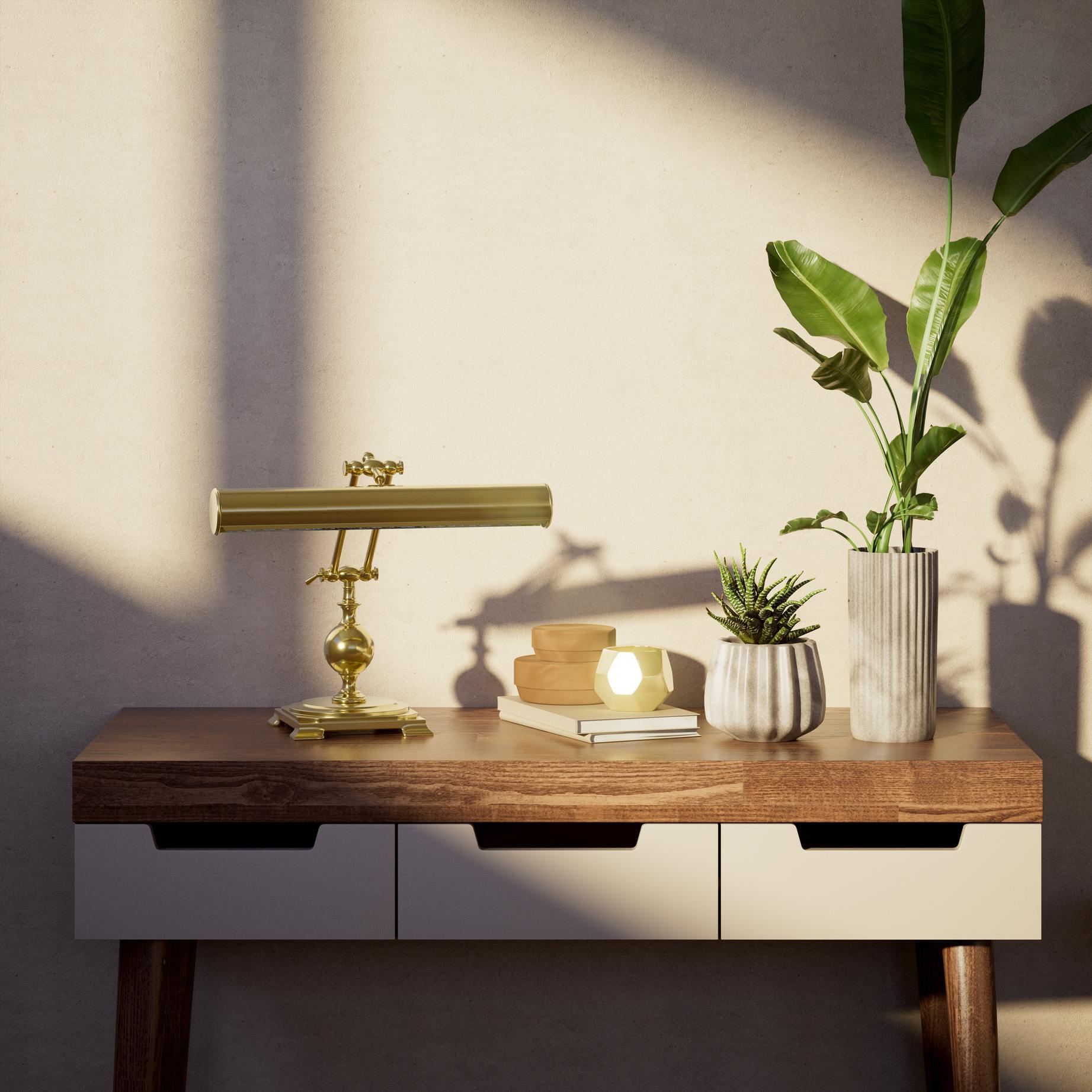 Executive brass desk lamp with cylindrical shade and dual articulation points mounted on decorative square base with spherical accent by Ghidini 1849 - Finish: OLV Polished Brass