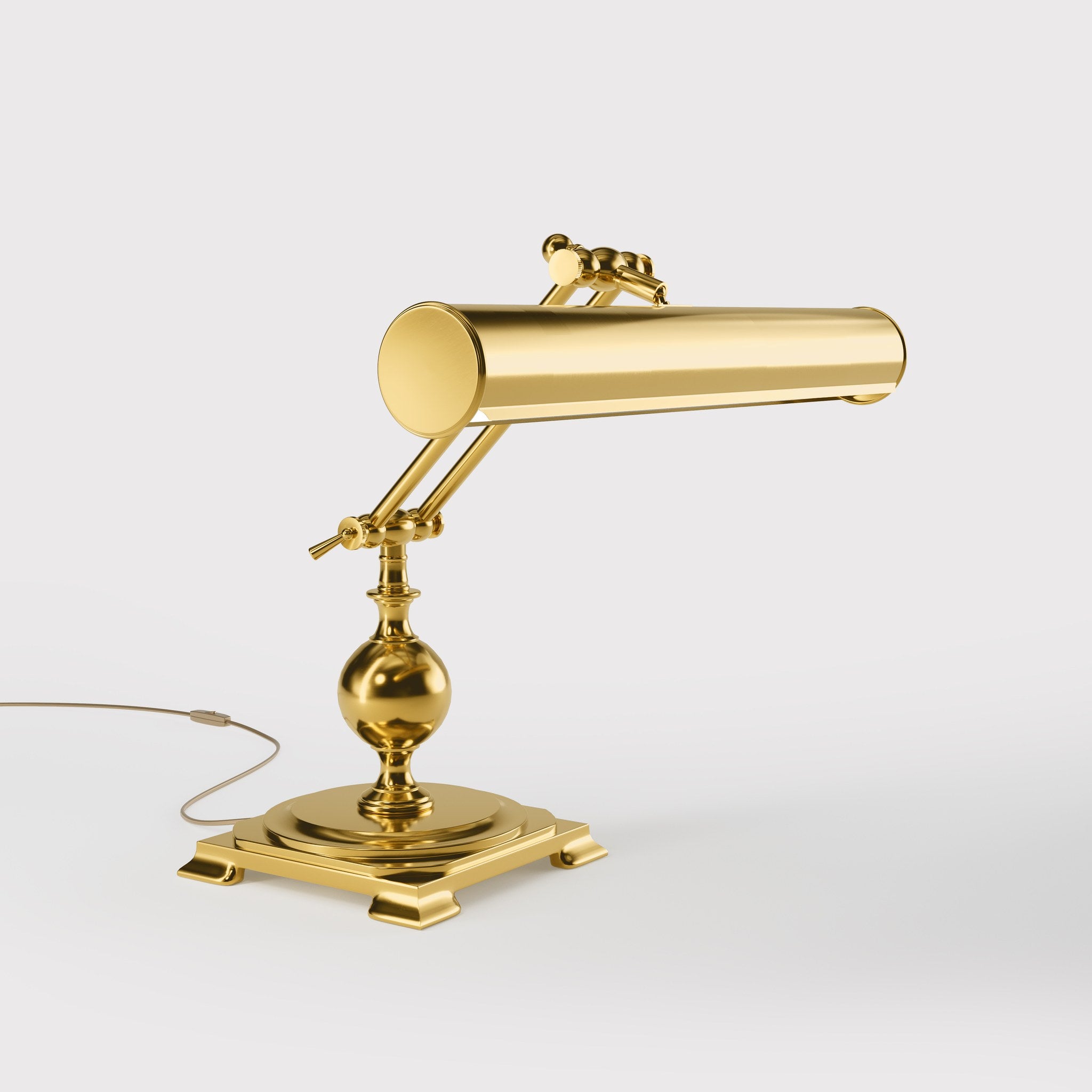 Executive brass desk lamp with cylindrical shade and dual articulation points mounted on decorative square base with spherical accent by Ghidini 1849 - Finish: ORO 24K Gold Plated