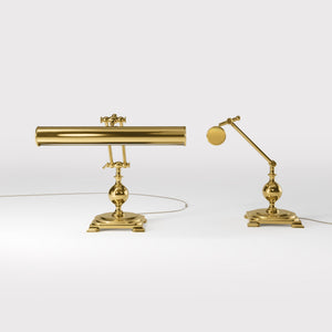 Executive brass desk lamp with cylindrical shade and dual articulation points mounted on decorative square base with spherical accent by Ghidini 1849 - Finish: ORO 24K Gold Plated