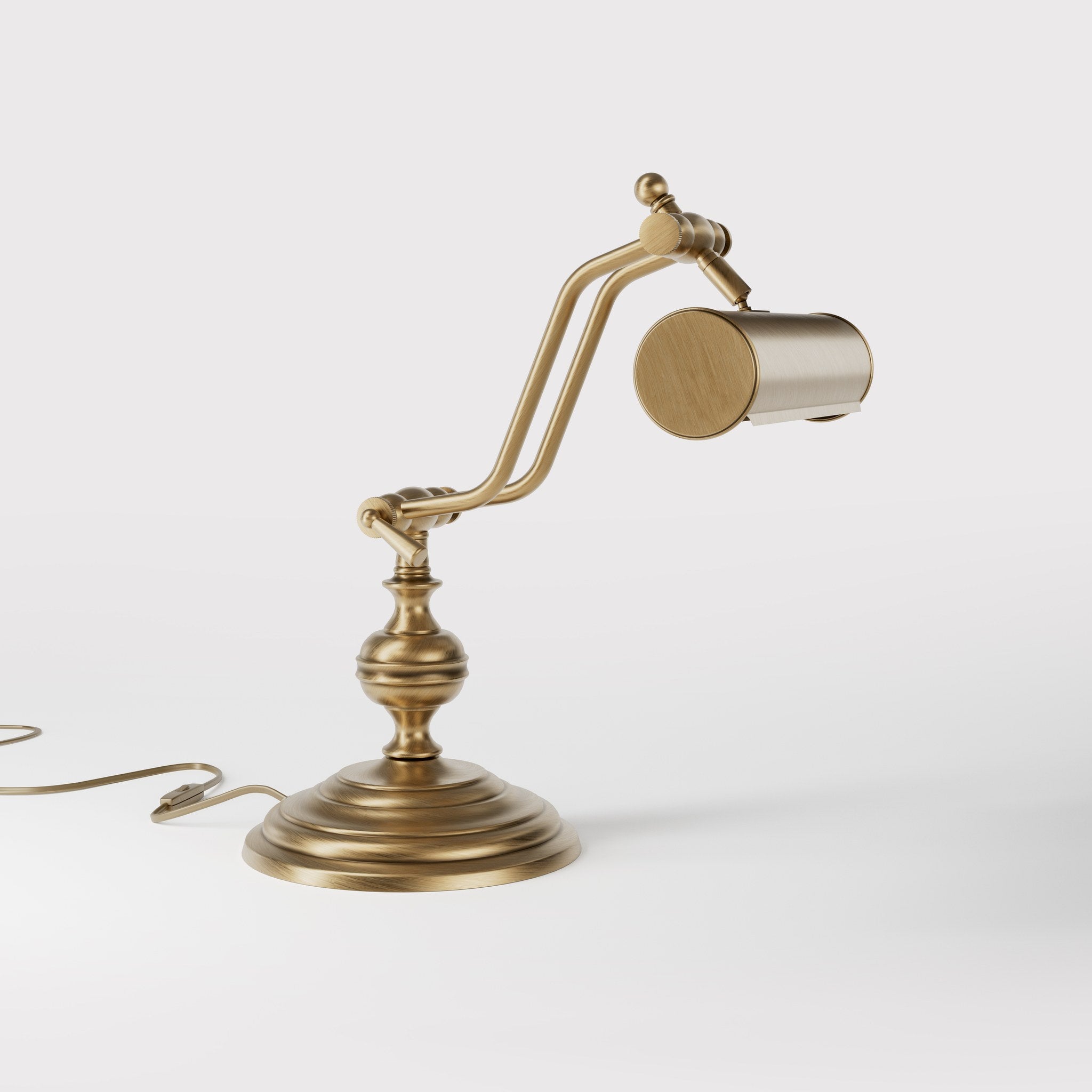 Brass study lamp with adjustable cylindrical shade on turned base with concentric moldings and dual joint system by Ghidini 1849 - Finish: OBS Bronze Satin Brass