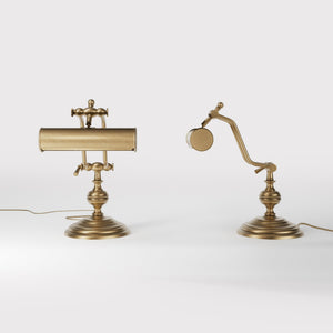 Brass study lamp with adjustable cylindrical shade on turned base with concentric moldings and dual joint system by Ghidini 1849 - Finish: OBS Bronze Satin Brass