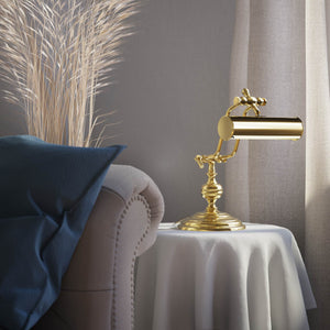 Brass study lamp with adjustable cylindrical shade on turned base with concentric moldings and dual joint system by Ghidini 1849 - Finish: OLV Polished Brass