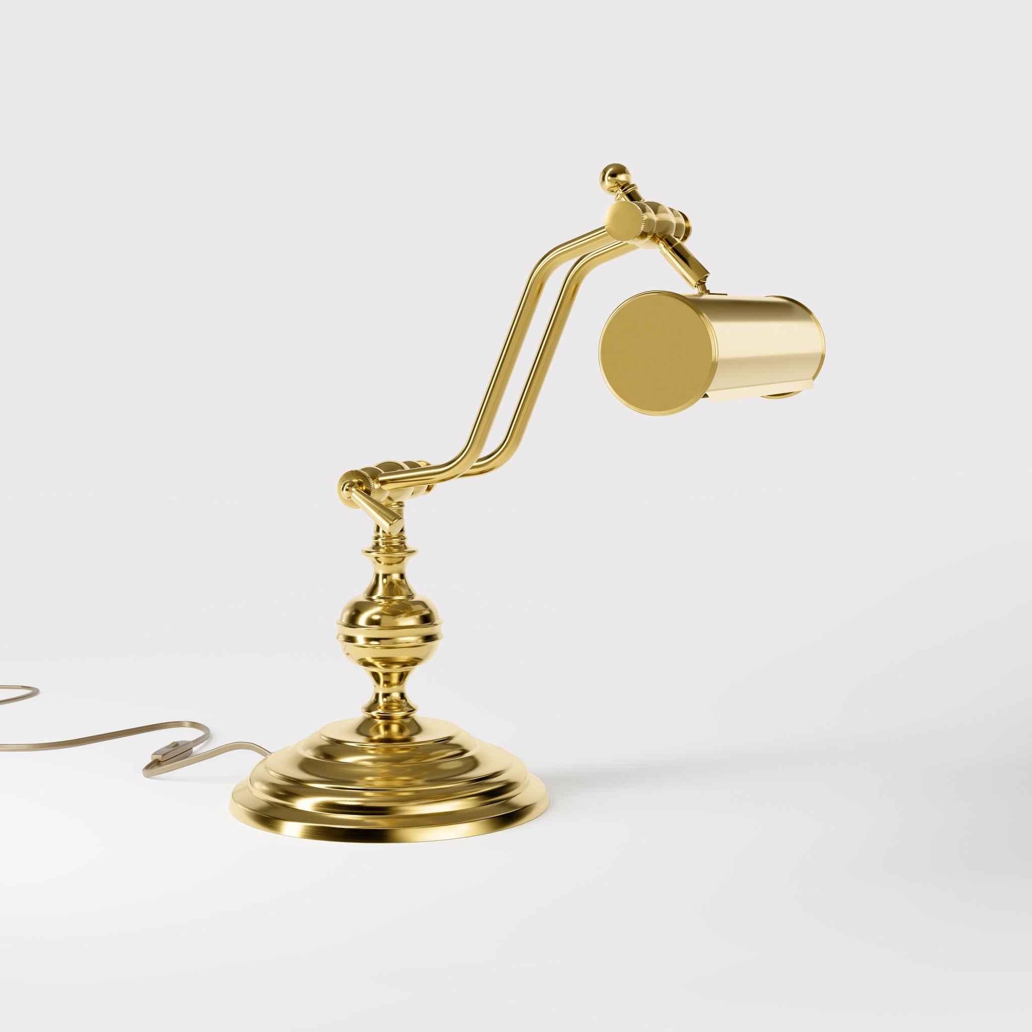 Brass study lamp with adjustable cylindrical shade on turned base with concentric moldings and dual joint system by Ghidini 1849 - Finish: ORO 24K Gold Plated