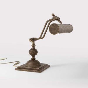 Vintage brass table lamp with adjustable cylindrical shade and articulated arm on square base with turned element by Ghidini 1849 - Finish: OAS Antique Brass