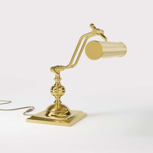 Vintage brass table lamp with adjustable cylindrical shade and articulated arm on square base with turned element by Ghidini 1849 - Finish: OLV Polished Brass