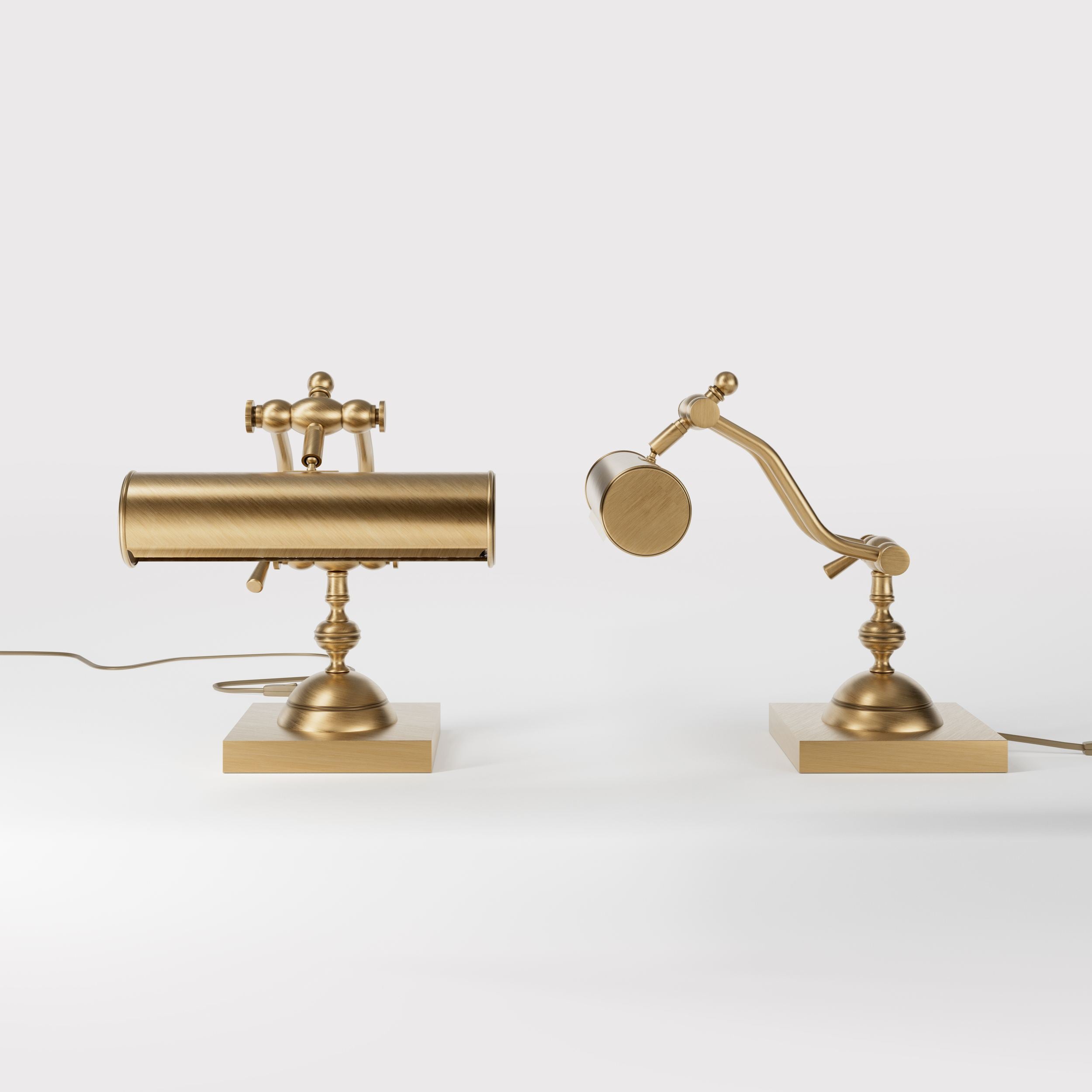 Articulated brass table lamp with adjustable arms and cylindrical shade industrial style for desk lighting by Ghidini 1849 - Finish: OBS Bronze Satin Brass