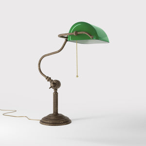 Classic brass banker desk lamp with green glass shade articulated arm and stepped base with fluted column by Ghidini 1849 - Finish: OAS Antique Brass