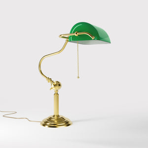 Classic brass banker desk lamp with green glass shade articulated arm and stepped base with fluted column by Ghidini 1849 - Finish: OLV Polished Brass