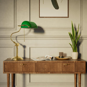 Classic brass banker desk lamp with green glass shade articulated arm and stepped base with fluted column by Ghidini 1849 - Finish: OLV Polished Brass