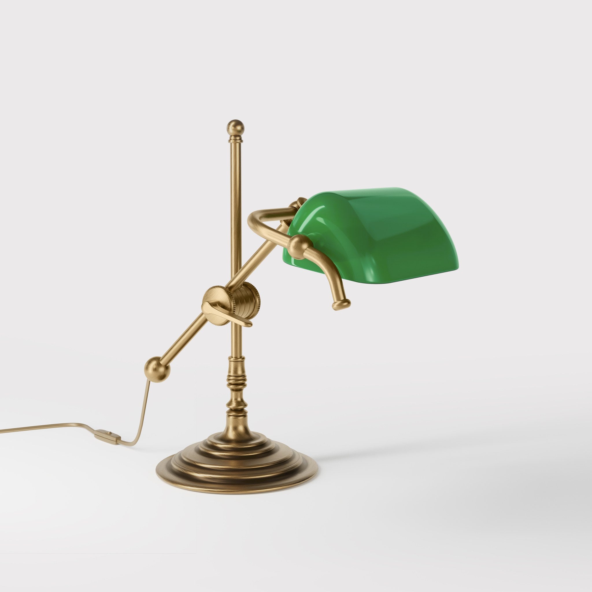 Mini brass desk lamp with green glass shade sliding arm on stem and turned circular base by Ghidini 1849 - Finish: OBS Bronze Satin Brass
