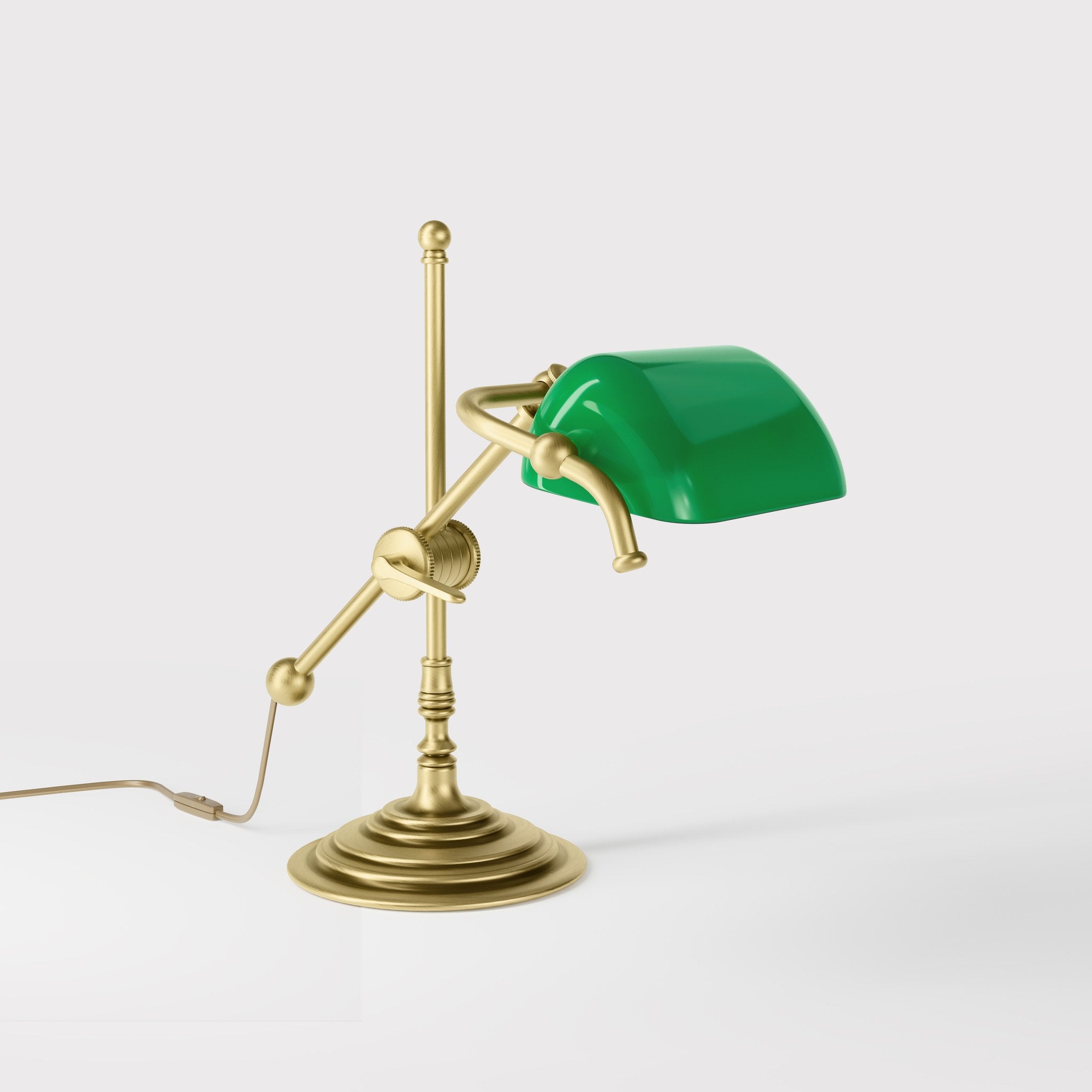 Mini brass desk lamp with green glass shade sliding arm on stem and turned circular base by Ghidini 1849 - Finish: OBV Bronze Satin Light Brass