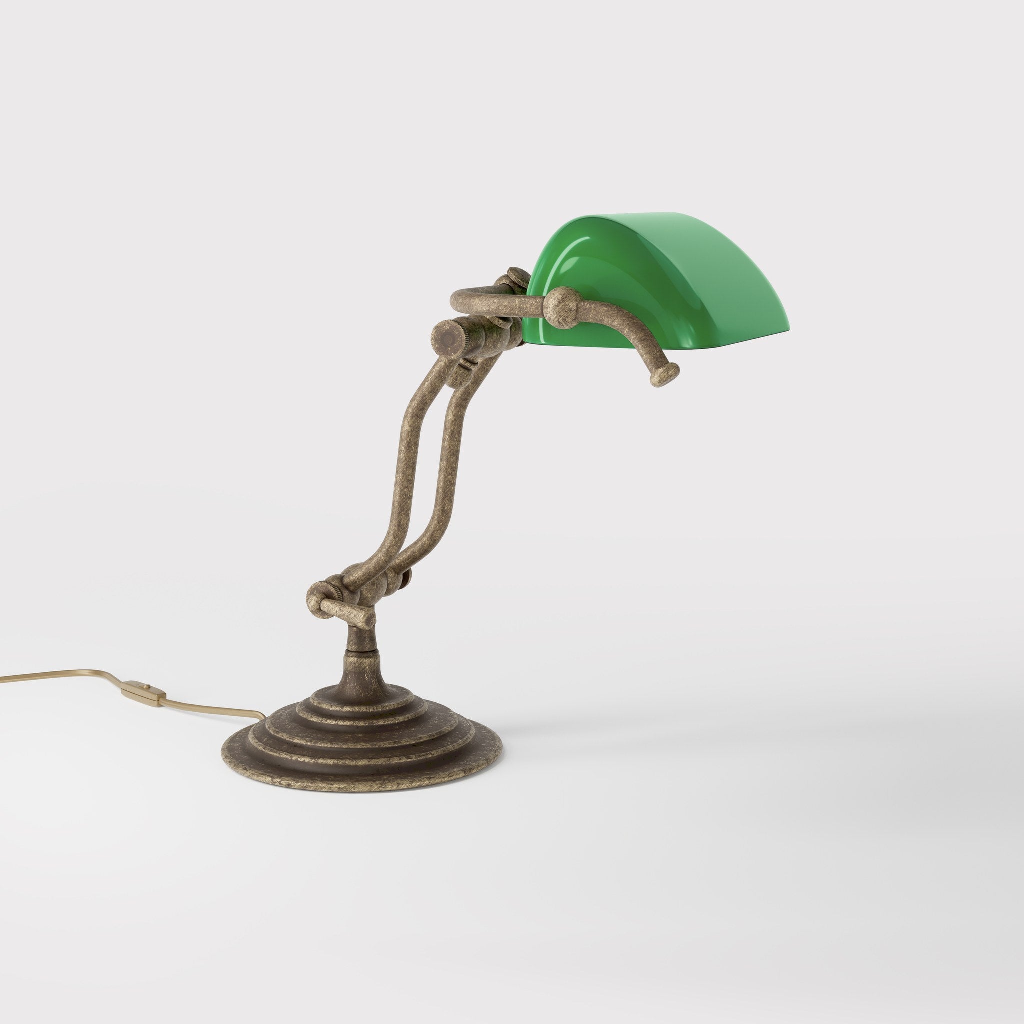 Compact brass desk lamp with green glass shade double joint system and stepped circular base by Ghidini 1849 - Finish: OAS Antique Brass