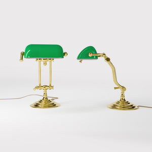 Compact brass desk lamp with green glass shade double joint system and stepped circular base by Ghidini 1849 - Finish: OLV Polished Brass