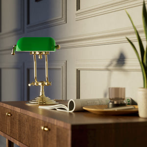 Compact brass desk lamp with green glass shade double joint system and stepped circular base by Ghidini 1849 - Finish: OLV Polished Brass