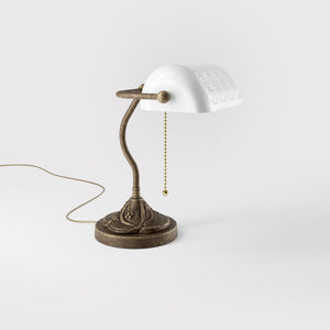 Art Nouveau table lamp with pierced white ceramic shade decorated brass base with floral motifs and pull chain by Ghidini 1849 - Finish: OAS Antique Brass