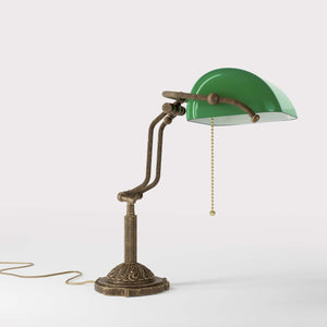Banker's lamp with green glass shade double joint ornamental brass base with leaf motifs and pull chain by Ghidini 1849 - Finish: OAS Antique Brass