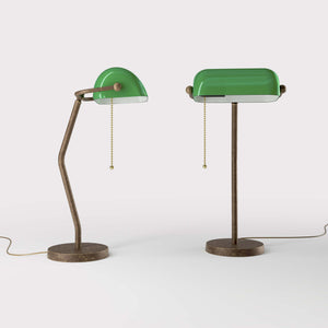 Minimalist table lamp with green glass shade circular brass base slender stem and pull chain by Ghidini 1849 - Finish: OAS Antique Brass