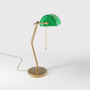 Minimalist table lamp with green glass shade circular brass base slender stem and pull chain by Ghidini 1849 - Finish: OBS Bronze Satin Brass